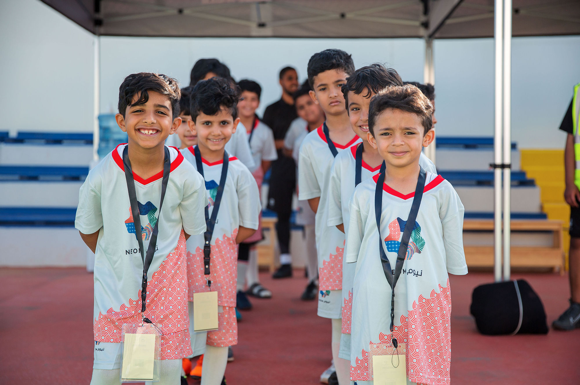 A group of boys playing football in NEOM