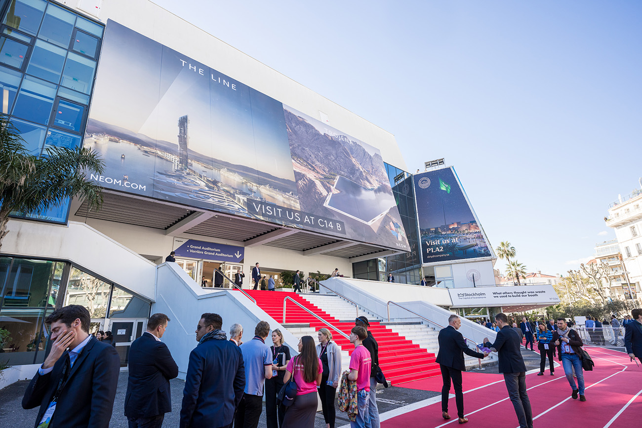  MIPIM 2024 entrance featuring NEOM's advertisements